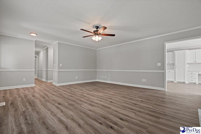 841 W Mallard Hen, Florence, SC 29505 - unfurnished living room with ceiling fan, wood finished floors, baseboards, and ornamental molding