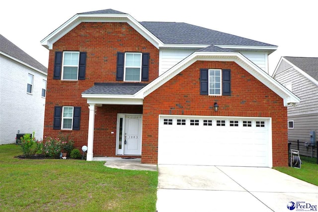 front of property featuring a garage and a front lawn