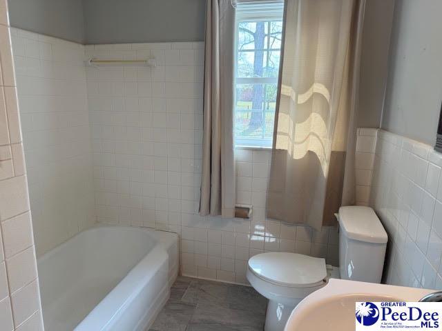 270 Quinby Cir, Quinby, SC 29506 - bathroom featuring toilet and tile walls