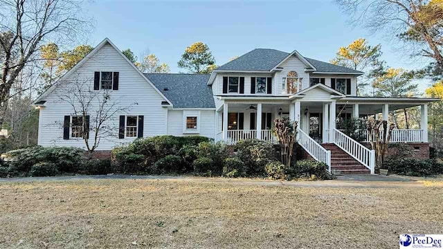 view of front facade with a porch and a front yard