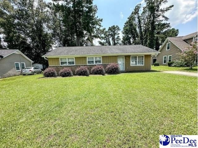 single story home with a front yard