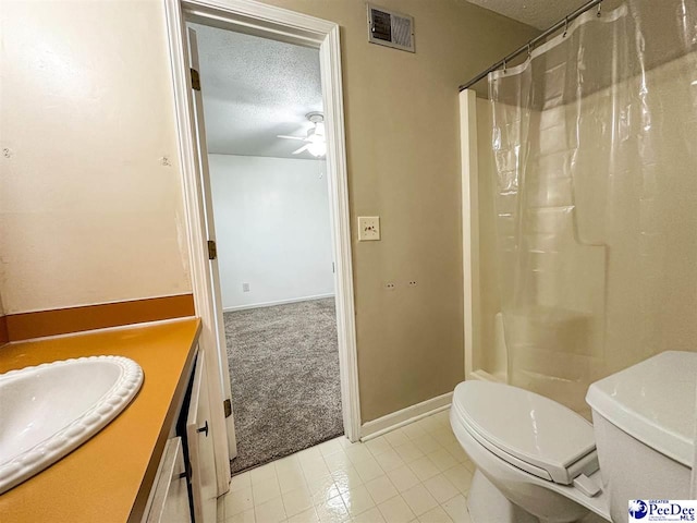 bathroom with walk in shower, toilet, a textured ceiling, vanity, and ceiling fan