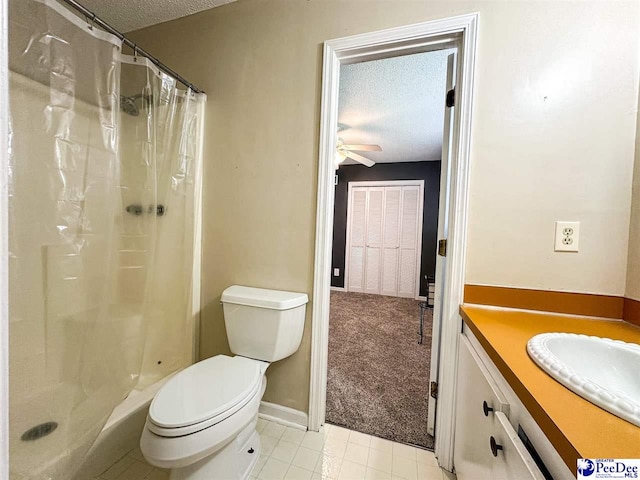 bathroom featuring vanity, a shower with shower curtain, a textured ceiling, and toilet