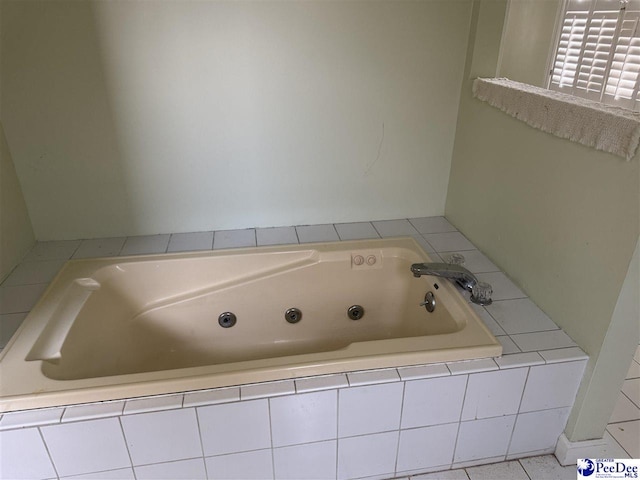 full bathroom with a jetted tub