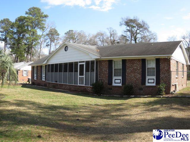 ranch-style house with a front lawn