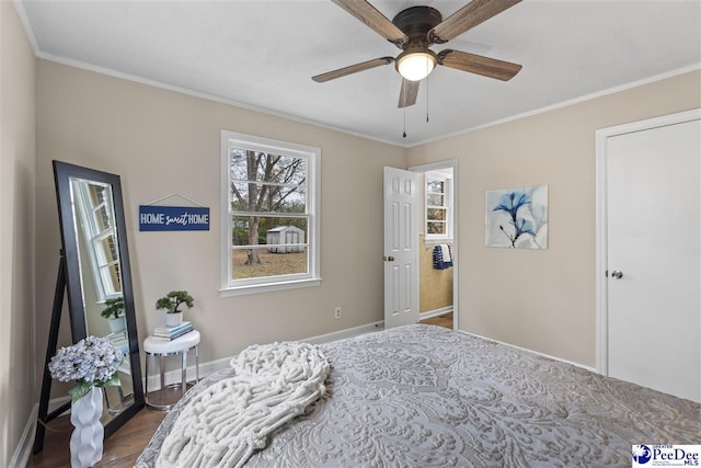 bedroom featuring hardwood / wood-style flooring, ceiling fan, and ornamental molding