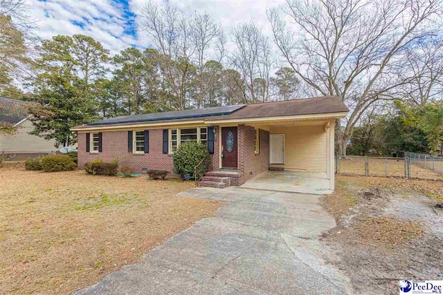 ranch-style house with a carport