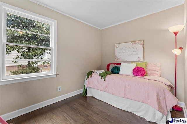 bedroom with dark wood-type flooring and ornamental molding