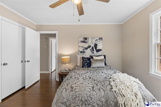 bedroom with ceiling fan, ornamental molding, and dark hardwood / wood-style floors