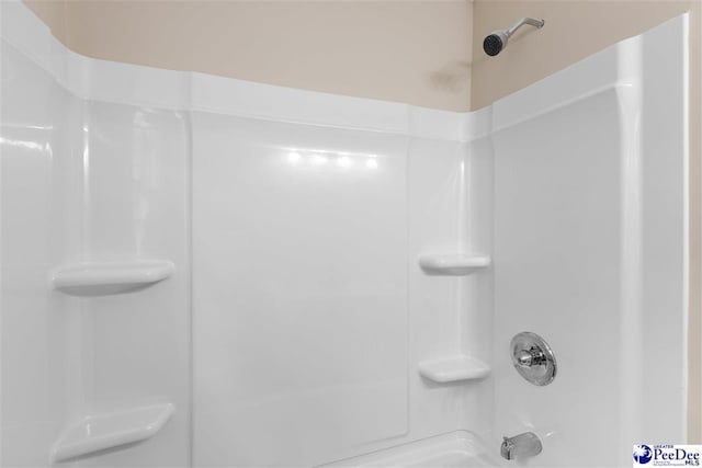 bathroom featuring  shower combination