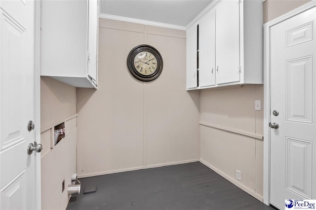 laundry area with dark hardwood / wood-style flooring, hookup for a washing machine, and ornamental molding