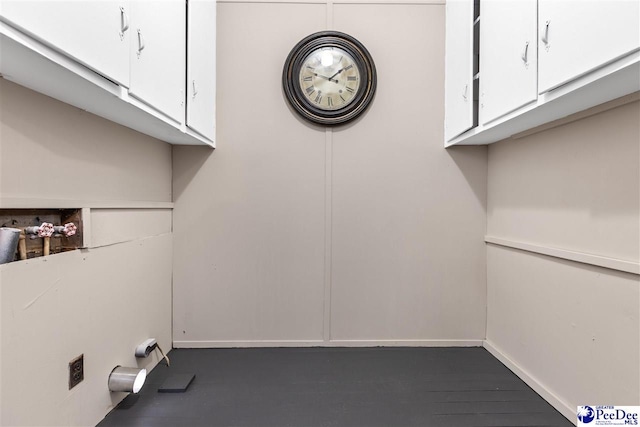 laundry area featuring hookup for a washing machine and cabinets