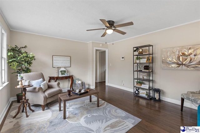 living room featuring crown molding, a wealth of natural light, ceiling fan, and dark hardwood / wood-style flooring