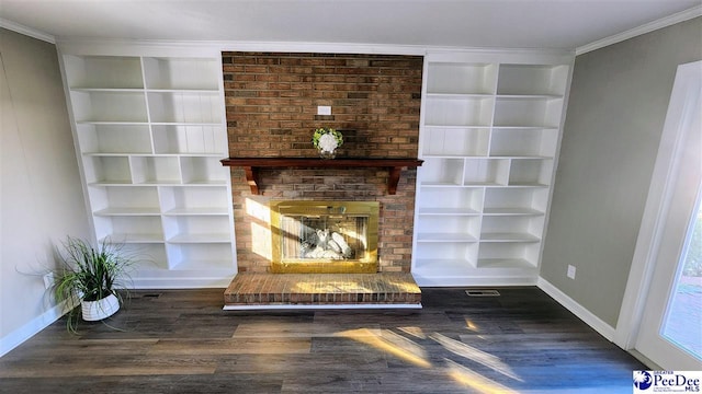 room details with built in shelves, ornamental molding, hardwood / wood-style floors, and a brick fireplace