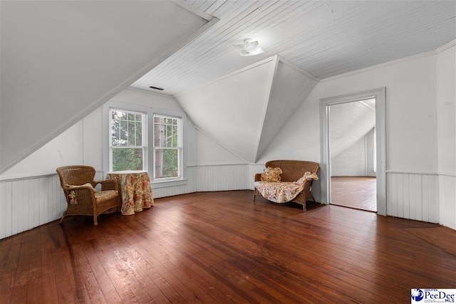 118 Ford Ave, Mullins, SC 29574 - additional living space featuring wood-type flooring, lofted ceiling, and a wainscoted wall
