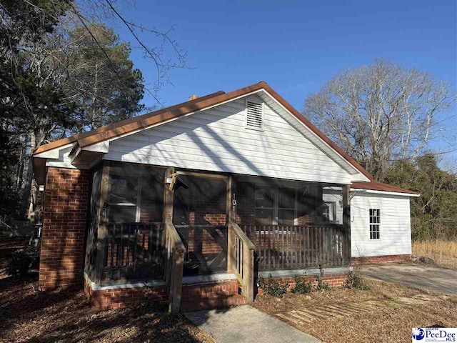 view of outbuilding featuring a porch