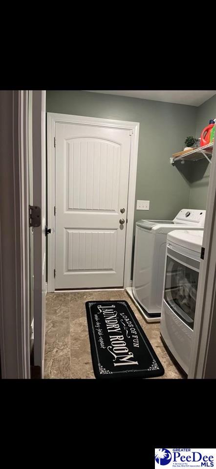 laundry area with washing machine and dryer