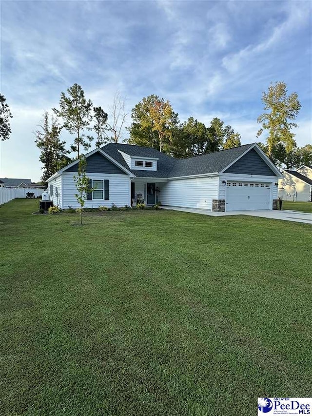 view of front of home featuring a garage and a front lawn