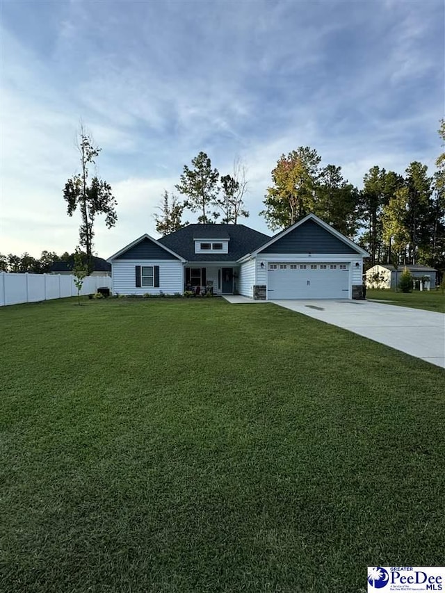 view of front facade featuring a garage and a front lawn