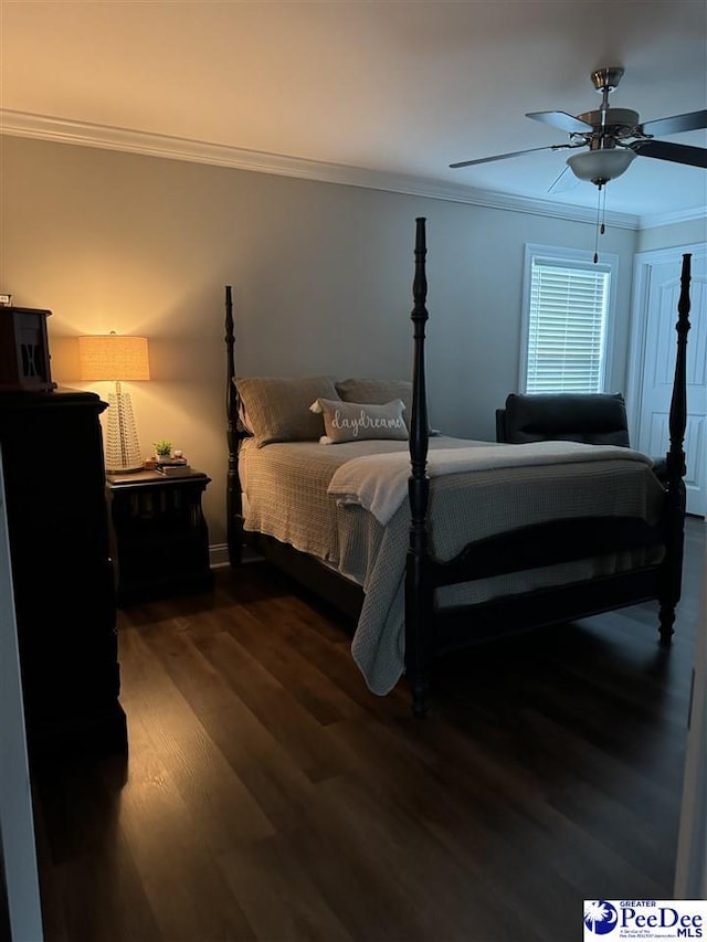 bedroom with ceiling fan, ornamental molding, and dark hardwood / wood-style floors