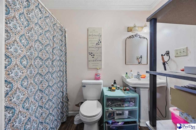 903 N Park St, Mullins, SC 29574 - bathroom with crown molding, a shower with shower curtain, and wood finished floors