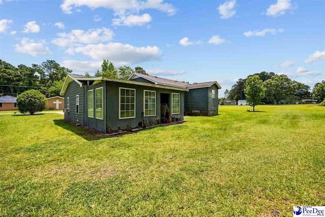 903 N Park St, Mullins, SC 29574 - back of house with a yard