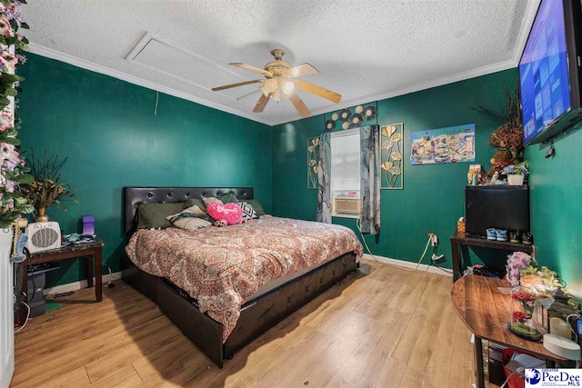 903 N Park St, Mullins, SC 29574 - bedroom with attic access, a textured ceiling, ornamental molding, wood finished floors, and a ceiling fan