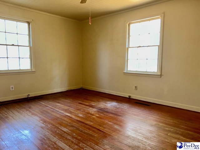 unfurnished room with crown molding, ceiling fan, and hardwood / wood-style flooring