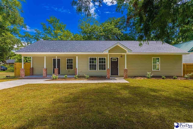 single story home featuring a carport and a front yard