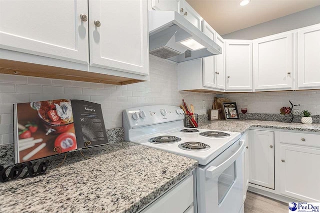 kitchen featuring white cabinetry and white electric stove