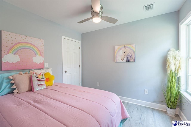 bedroom featuring ceiling fan and light wood-type flooring