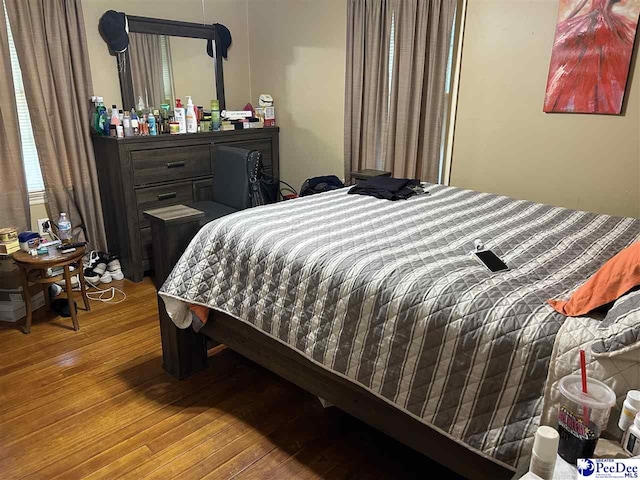 bedroom featuring hardwood / wood-style flooring