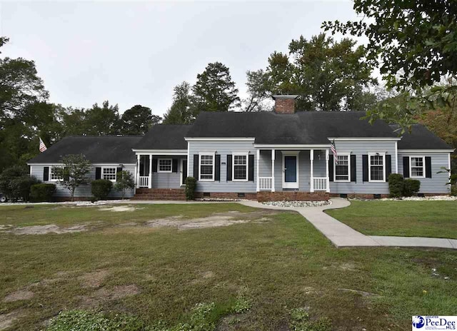 view of front facade featuring a front lawn and covered porch