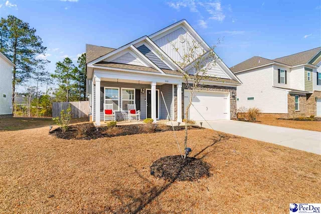 view of front facade with a porch and a garage