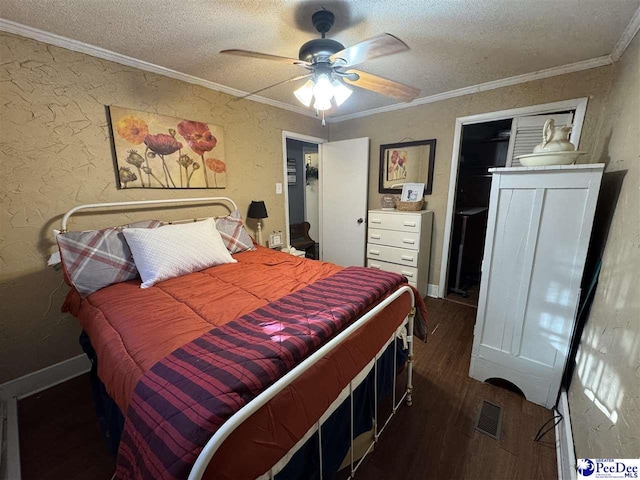 5644 Blue Cap Rd, Florence, SC 29506 - bedroom featuring crown molding, dark hardwood / wood-style floors, ceiling fan, and a textured ceiling