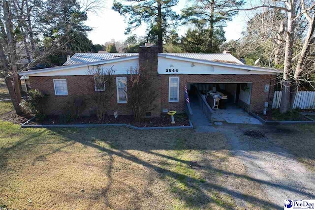 view of property exterior featuring a garage and a yard