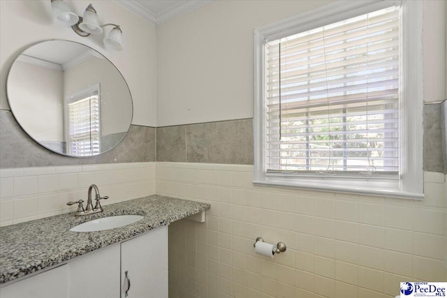 516 S Cashua Dr, Florence, SC 29501 - bathroom featuring crown molding, vanity, tile walls, and a wainscoted wall