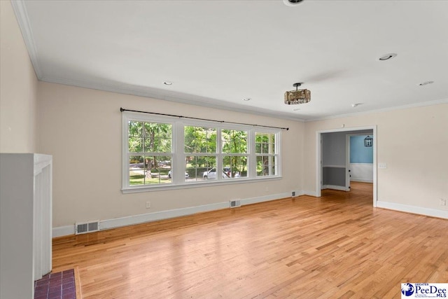 516 S Cashua Dr, Florence, SC 29501 - unfurnished living room with ornamental molding, plenty of natural light, and light wood-type flooring