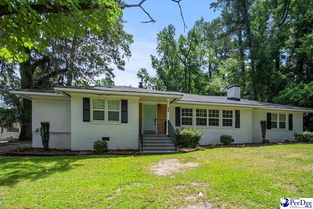 516 S Cashua Dr, Florence, SC 29501 - ranch-style home with a chimney and a front yard