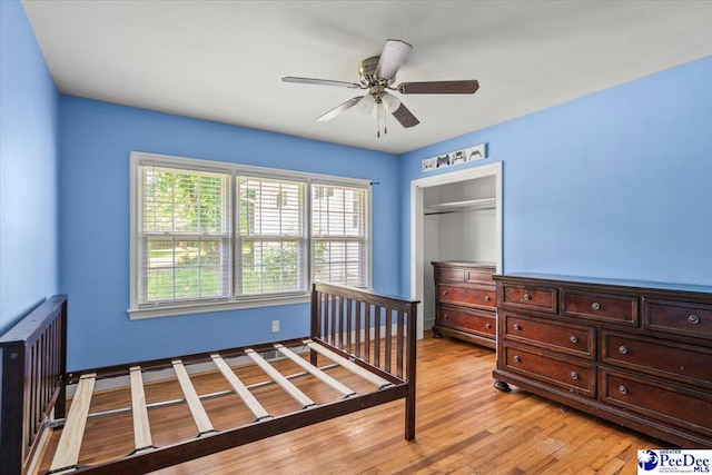 516 S Cashua Dr, Florence, SC 29501 - bedroom with light wood-style flooring, a closet, and a ceiling fan