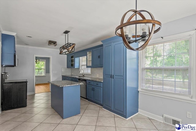 516 S Cashua Dr, Florence, SC 29501 - kitchen featuring blue cabinetry, ornamental molding, light tile patterned flooring, light stone countertops, and a kitchen island