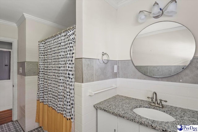 516 S Cashua Dr, Florence, SC 29501 - full bath with tile walls, crown molding, vanity, wainscoting, and curtained shower