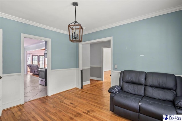 516 S Cashua Dr, Florence, SC 29501 - living area with a chandelier, light wood-style flooring, and crown molding