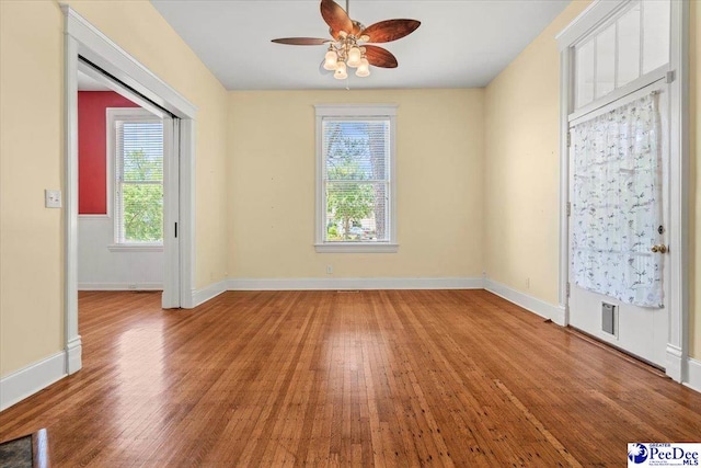 302 Cashua St, Darlington, SC 29532 - spare room with wood finished floors, a ceiling fan, and baseboards