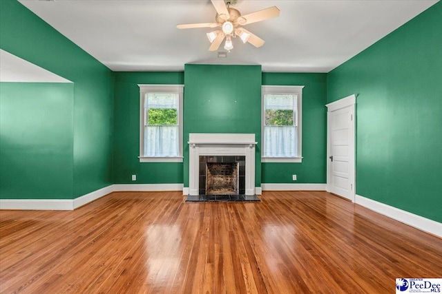302 Cashua St, Darlington, SC 29532 - unfurnished living room with plenty of natural light, a fireplace, wood finished floors, and baseboards