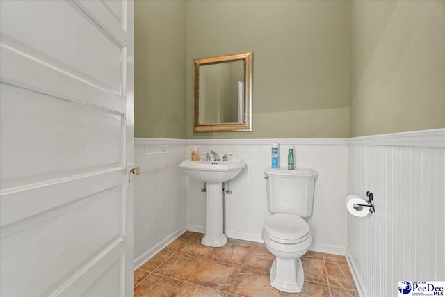 302 Cashua St, Darlington, SC 29532 - bathroom with wainscoting, toilet, and a sink