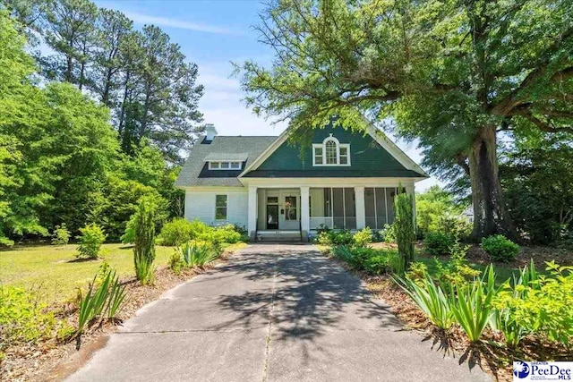 302 Cashua St, Darlington, SC 29532 - view of front of house with driveway and a sunroom