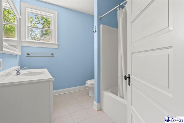 302 Cashua St, Darlington, SC 29532 - bathroom with toilet, tile patterned flooring, baseboards, vanity, and shower / bath combo with shower curtain