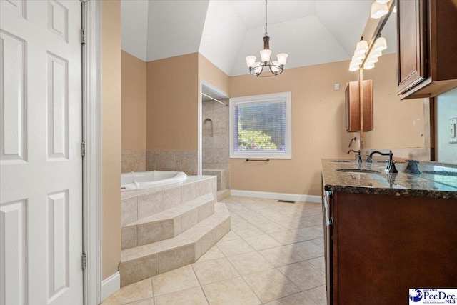 302 Cashua St, Darlington, SC 29532 - full bath with tile patterned floors, a chandelier, a garden tub, baseboards, and vanity