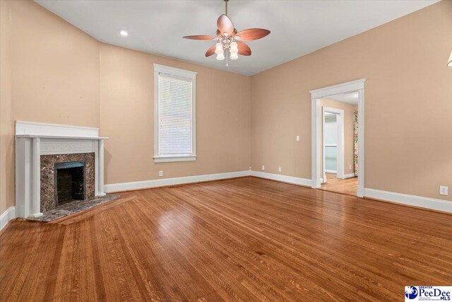 302 Cashua St, Darlington, SC 29532 - unfurnished living room with ceiling fan, baseboards, wood finished floors, and a premium fireplace